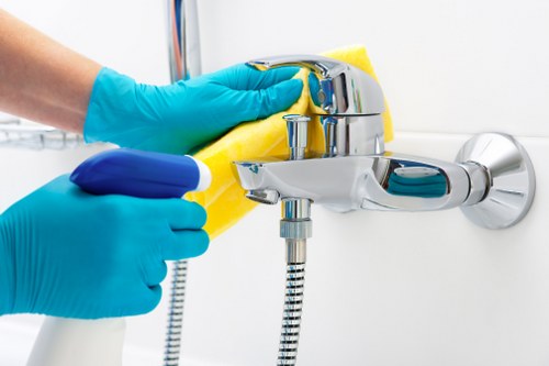 Domestic cleaner working in a Brixton kitchen and living space